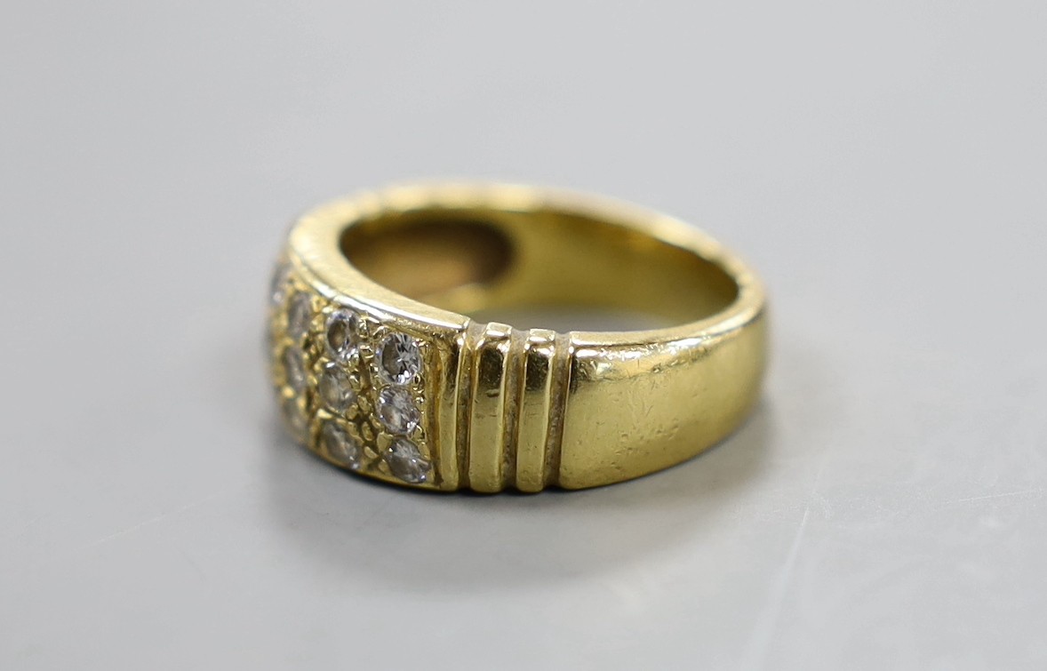 A yellow metal and eighteen stone pave set diamond ring, size Q/R